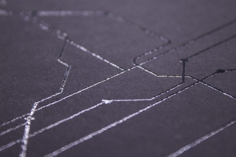 Close view of creasing and embossing rules on a die-cutting plate